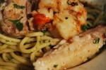 Fresh Fish & King Prawns on a bed
 of Spaghetti with Parsley & Chili.